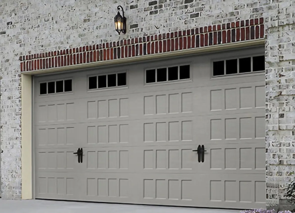 Hillcrest garage door in a soft gray finish with short panel windows