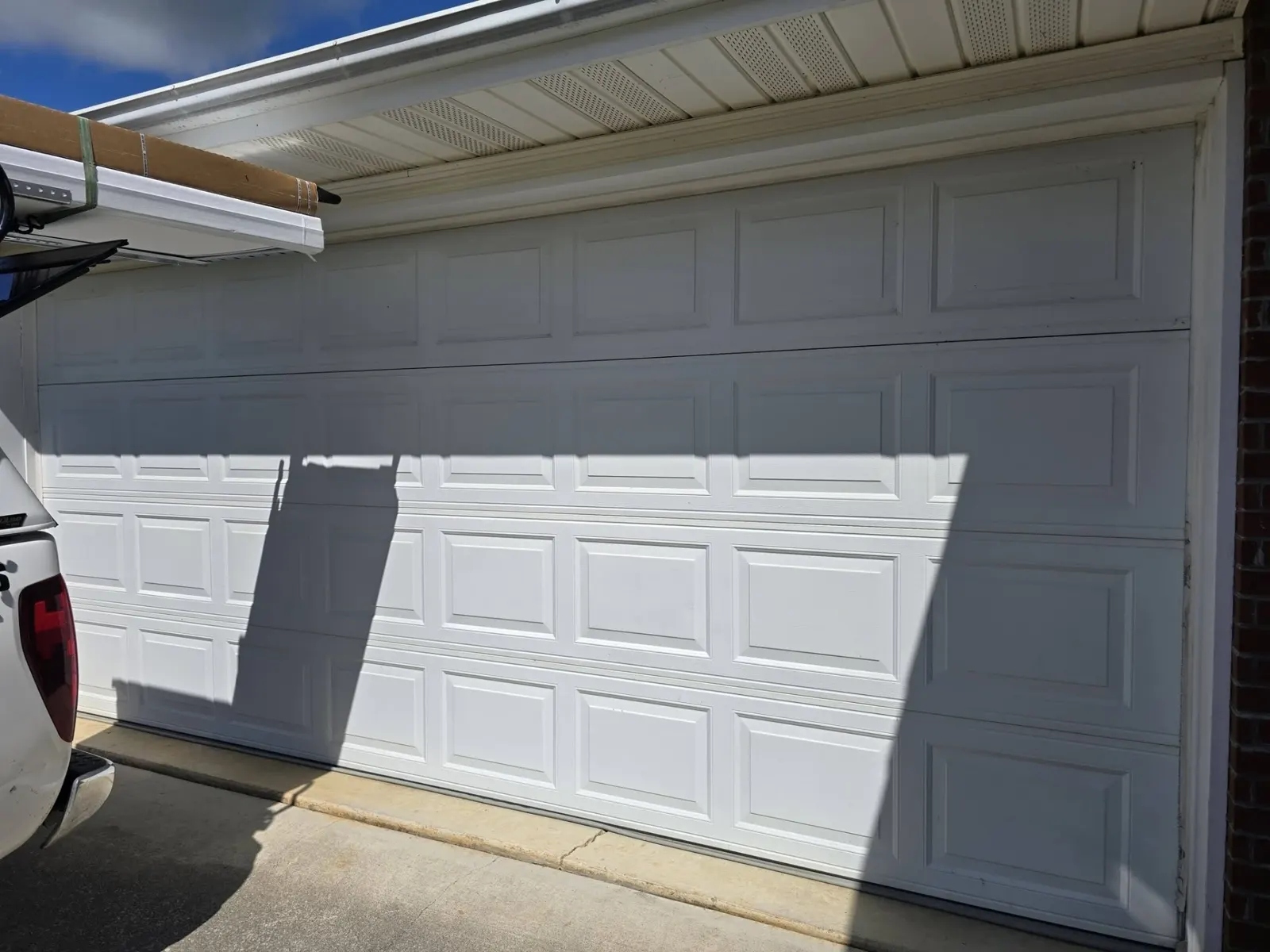 Replacement white raised-panel double garage door
