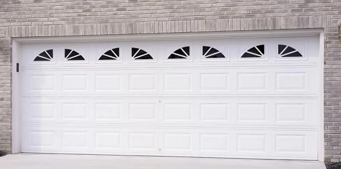 Lincoln garage door in white with sunburst window inserts