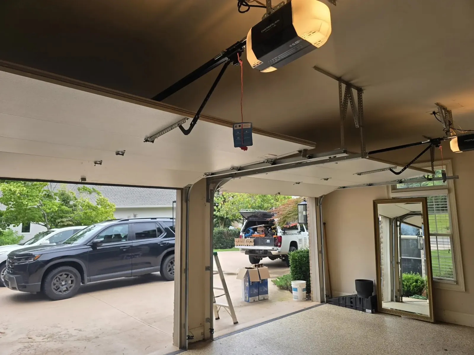 New garage door opener installed on a residential garage ceiling