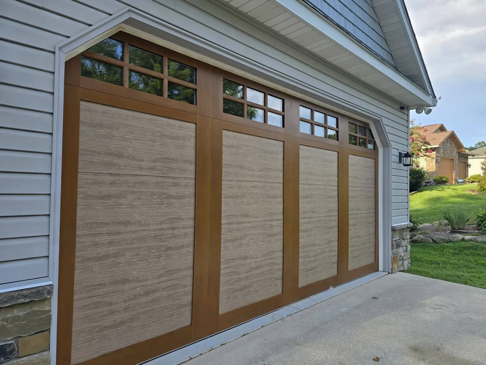 Side profile view of a wood-grain garage door